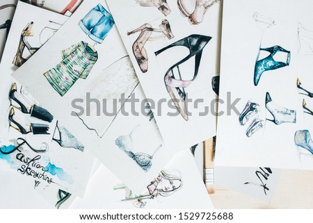 Designer workplace. Fashion sketching. Colorful women clothing footwear drawing collection.