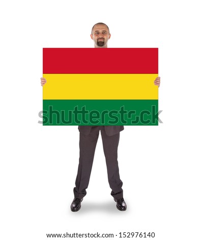 Businessman holding a big card, flag of Bolivia, isolated on white