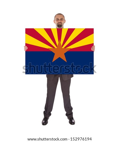 Smiling businessman holding a big card, flag of Arizona, isolated on white