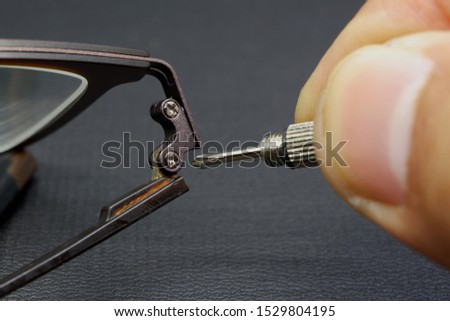 Repairing eyeglass activity with black background