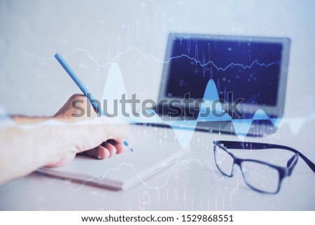 Multi exposure of man hands with stock market forex graph.