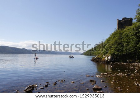 Picture of the beautiful  Loch Ness with Urquarht Castle in the upper right corner.