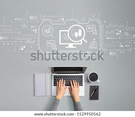 Stock trading concept with person using a laptop