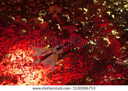 Retro sci-fi shot of a space ship flying through an asteroid field. 