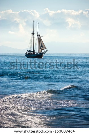 The ship sails at sea  Royalty-Free Stock Photo #153009464