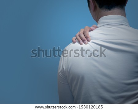 Asian suffering from stiff shoulders