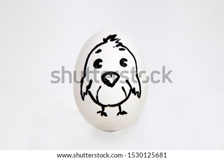 egg on a white background with a picture of a chicken
