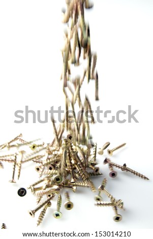 Screws falling on isolated white