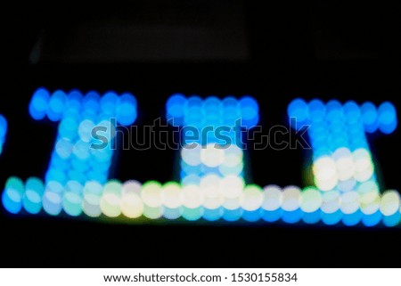 Abstract texture with blurred colored light line and black background in night