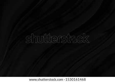 Black dark fabric satin texture that is black silk background with beautiful soft blur pattern luxury .