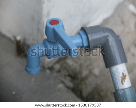 image of a water-saving plastic water faucet