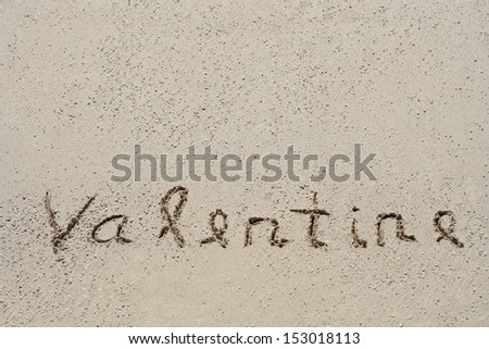 Concept or conceptual hand made or handwritten text in sand on a beach in an exotic island as metaphor to love,valentine,valentine`s,summer,spring,romantic,romance,vacation,travel,greeting or holiday