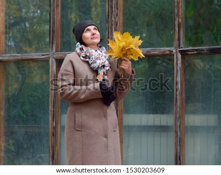 Beautiful brunette woman in autumn yellow park 2019