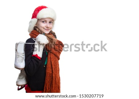 Winter Activities Concepts. Tranquil Caucasian Girl With Pigtails Posing in Winter Outfit With Ice-Skates Against White in Studio. Horizontal Image