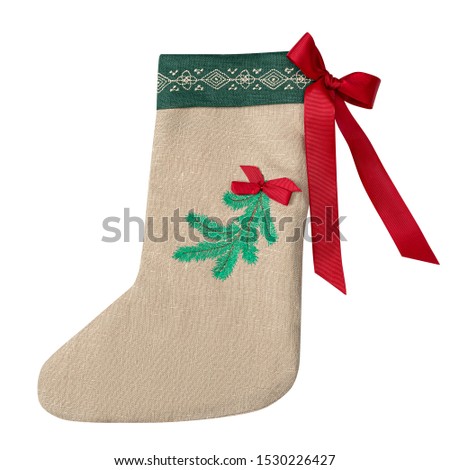 Christmas sock isolated on white background. Christmas sock with fir branch and satin red ribbon bow
