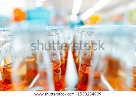 photo of many bottles with bokeh in a hypermarket