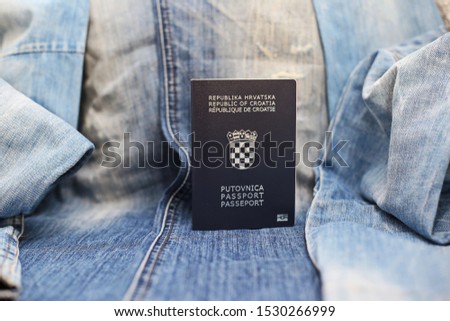 Croatian passport on jeans background