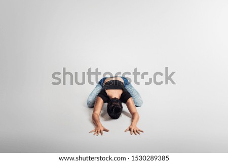 Yoga child pose, stretching, woman on white background, studio photos