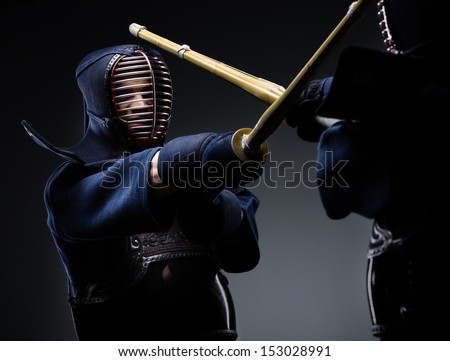 Competition of two kendo fighters. Japanese martial art of sword fighting Royalty-Free Stock Photo #153028991