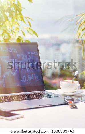Laptop on a window background on a bright sunny day