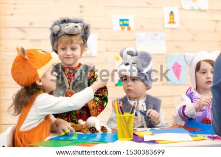 Group of funny kids prepare to x-mas holiday. Children weared animal costumes