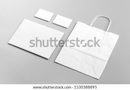 Photo. Template for branding identity. For graphic designers presentations and portfolios. Identity Mock-up with white paper bag isolated on gray background. Identity set mock-up. Photo mock up.