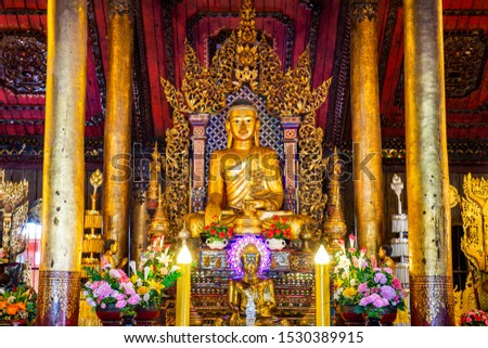 Old Buddha statue in Nantaram temple, Thailand.