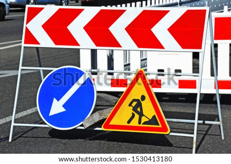 Sign and fence on road construction work