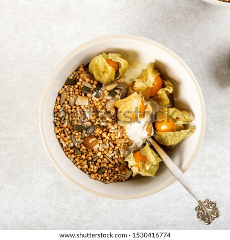 New vegan healthy snack from quinoa granola with yogurt and physalis, this is nutritionally enhanced quinoa based breakfast alternative, free from gluten, grains, dairy and refined sugar