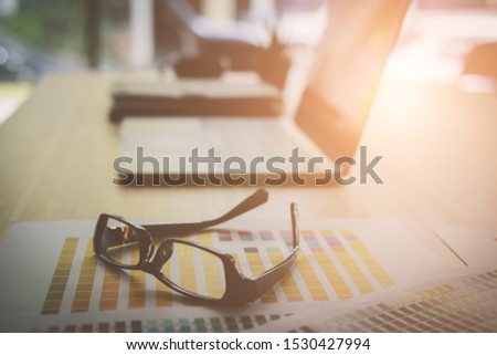 eyeglasses, color swatch sample on office desk. graphic designer, artist workspace. creative design work. business workplace concept.