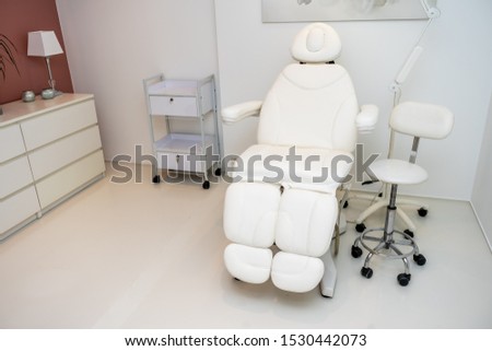 Beauty treatment white chair in beauty saloon