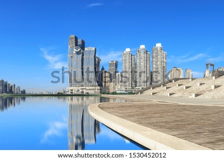Wooden board square and modern city financial district skyline in Chongqing,China.