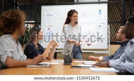 Diverse staff and business trainer starting seminar lecturer giving learning material for workshop, corporate clients or investors receiving statistical financial data before negotiating and analysing Royalty-Free Stock Photo #1530452672