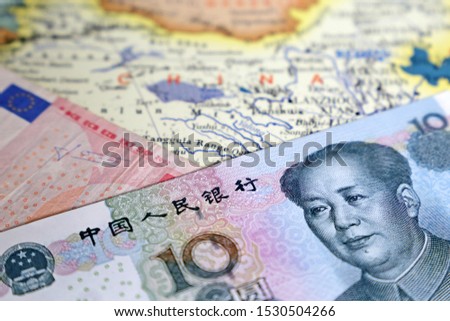 Chinese yuan and Euro money on the map of China. Exchange rate, trade and investment between EU and China