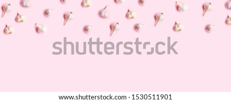 Flat lay composition with fresh garlic on light background. Health and care concept.