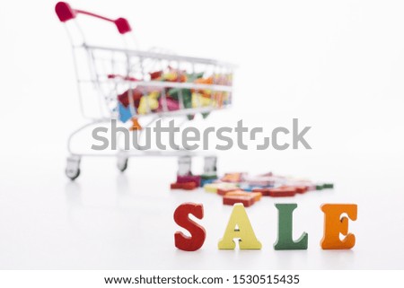 Sale sign with shopping cart front view
