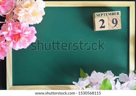 Number cube of Date, Background design with sakura flower on the green board, September 29.
