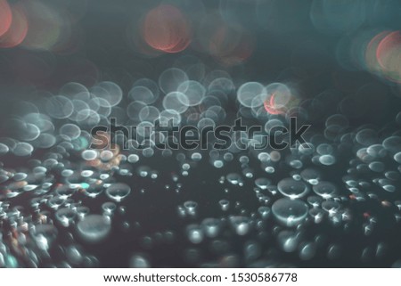Beautiful light bokeh on a  white and darkness background.