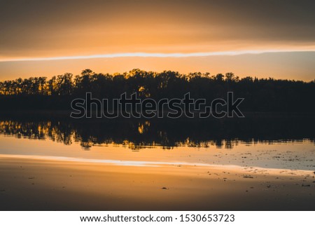 Beautiful sunset on a lake in Berchtesgadener Land Bavaria Germany