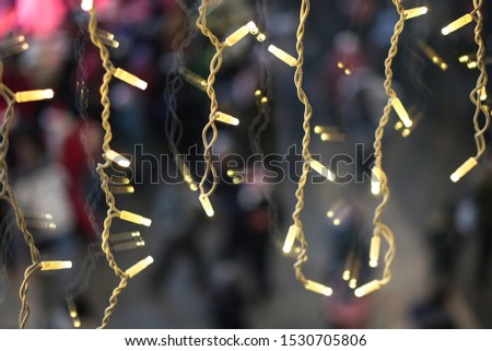 Beautiful Christmas background with garlands and bokeh. Christmas multi-colored picture. Abstract photo image for design