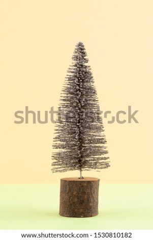 Christmas tree on pastel colored background. Christmas or New Year minimal concept.