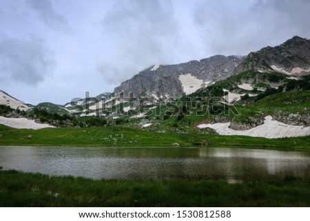 Scenic of mountain lake near Fisht Mount, Adygea, Russia