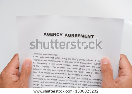
Agency contract form and fountain pen