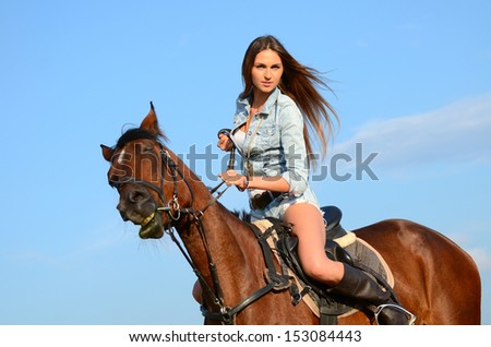 The woman on horse against the sky