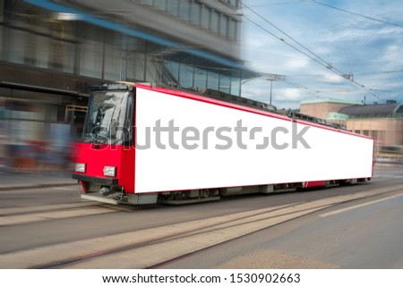 Red tram with large empty blank poster mock-up on street of city, mock-up