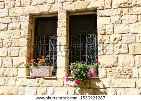 small window in a big city in Israel