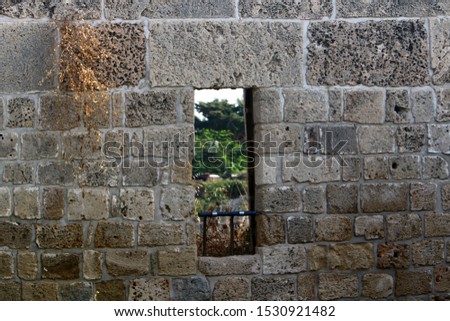small window in a big city in Israel