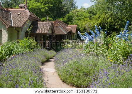 English cottage and garden, path leading to entrance.