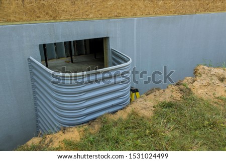 Building for house basement concrete construction install for window well a house under construction Royalty-Free Stock Photo #1531024499