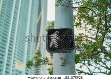 pedestrian crossing traffic sign tree green leaves